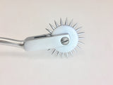 stainless steel Wartenberg pinwheel is used for neurological assessment and is designed to test nerve reactions as the spikes roll across the skin. 
