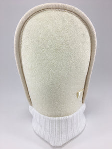 Our loofah mitt is made from natural materials.  There are two sides, a softer side made of terry and the other is rough for exfoliating,  but still gentle enough for sensitive skin.  It takes away dead skin cells leaving the skin smooth and soft.